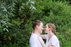 Happy pregnant woman and her husband in the park