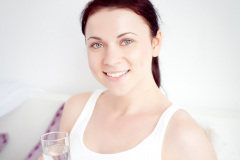 young pregnant woman in the bedroom